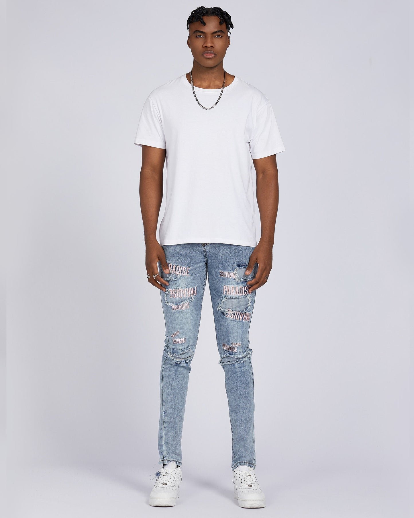 Logeqi light wash blue ripped jeans featuring stylish distressing and a slim fit design