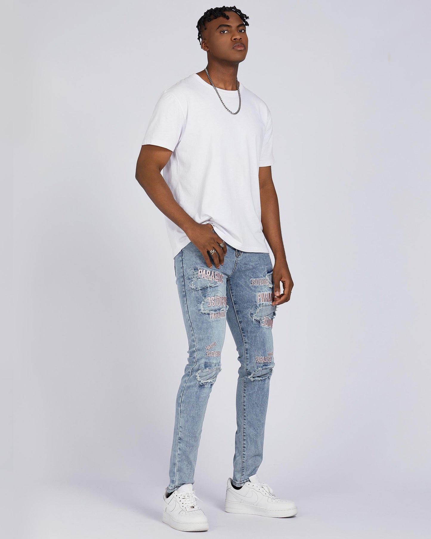 Logeqi light wash blue ripped jeans for men with stylish distressed detailing and a fitted silhouette