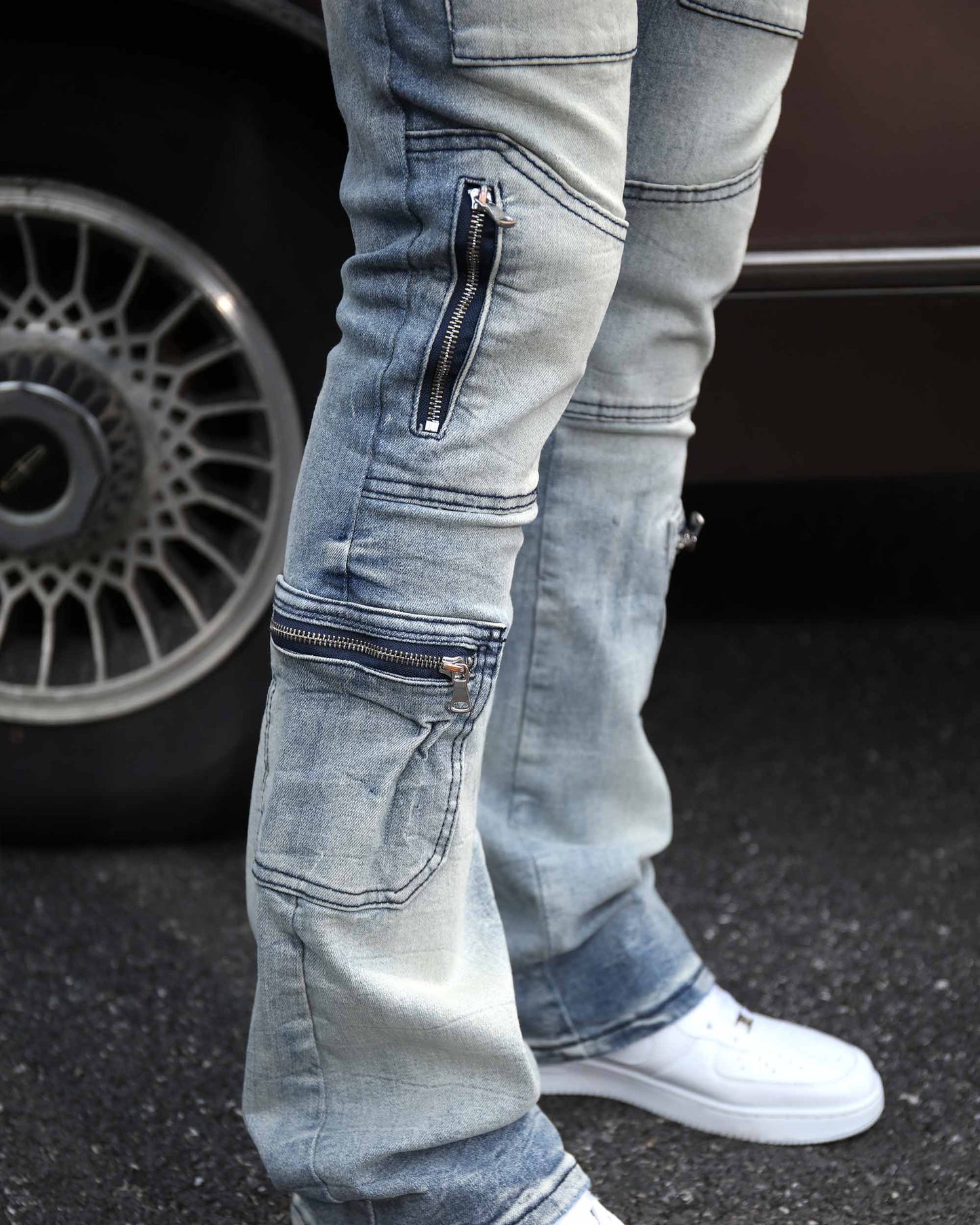 Logeqi light wash distressed cargo jeans with multiple pockets and zipper details for a trendy look