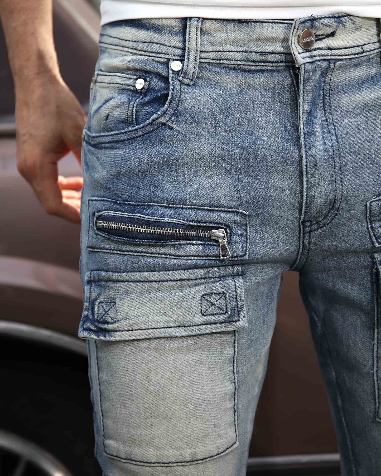 Light wash distressed cargo jeans by Logeqi featuring multiple pockets and a stylish design
