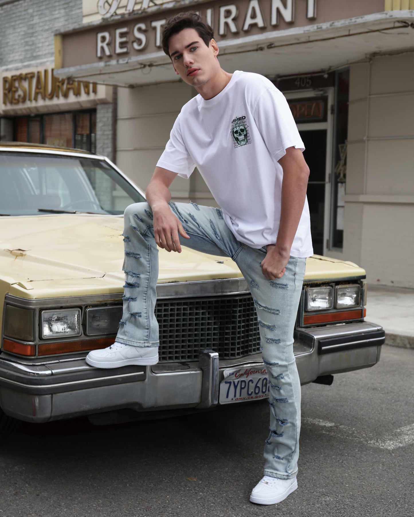 Logeqi light wash flared jeans with distressed detailing, styled for a casual urban look