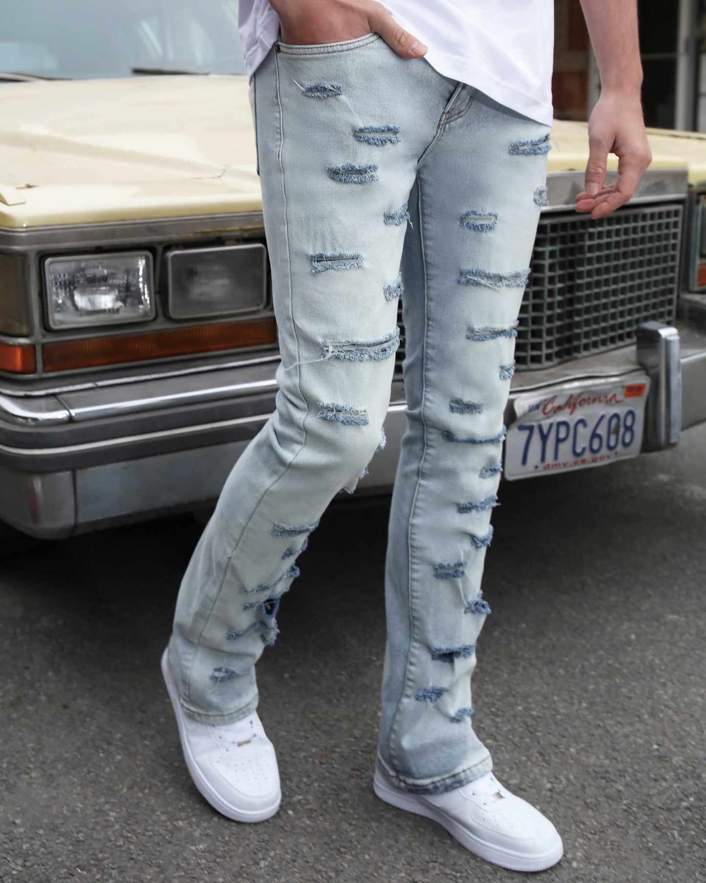 Logeqi light wash flared jeans featuring distressed details for a trendy style