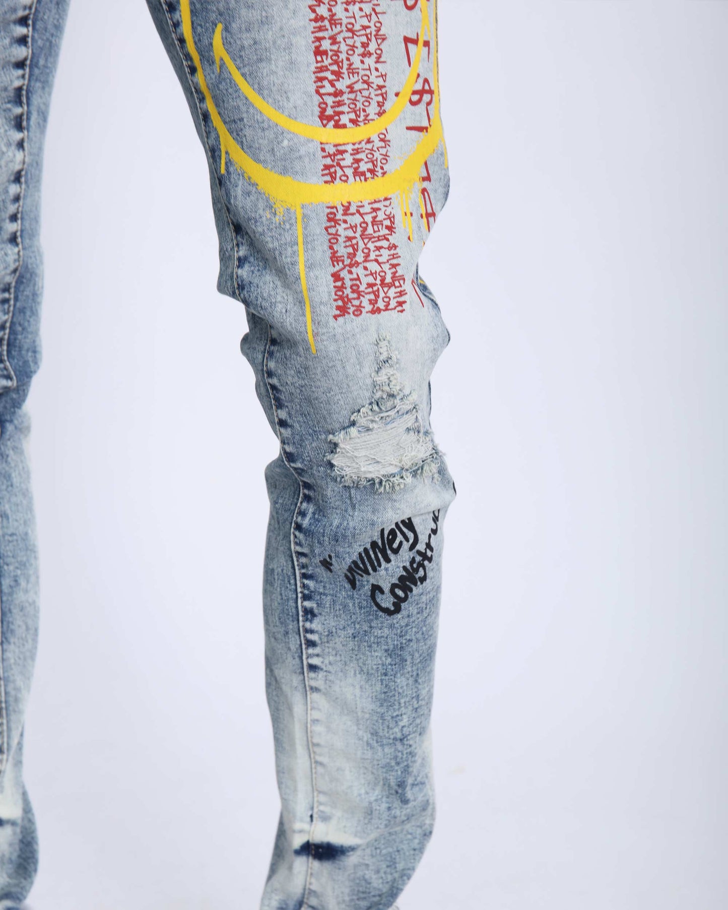 Logeqi light wash ripped jeans featuring unique graphic designs and distressed details