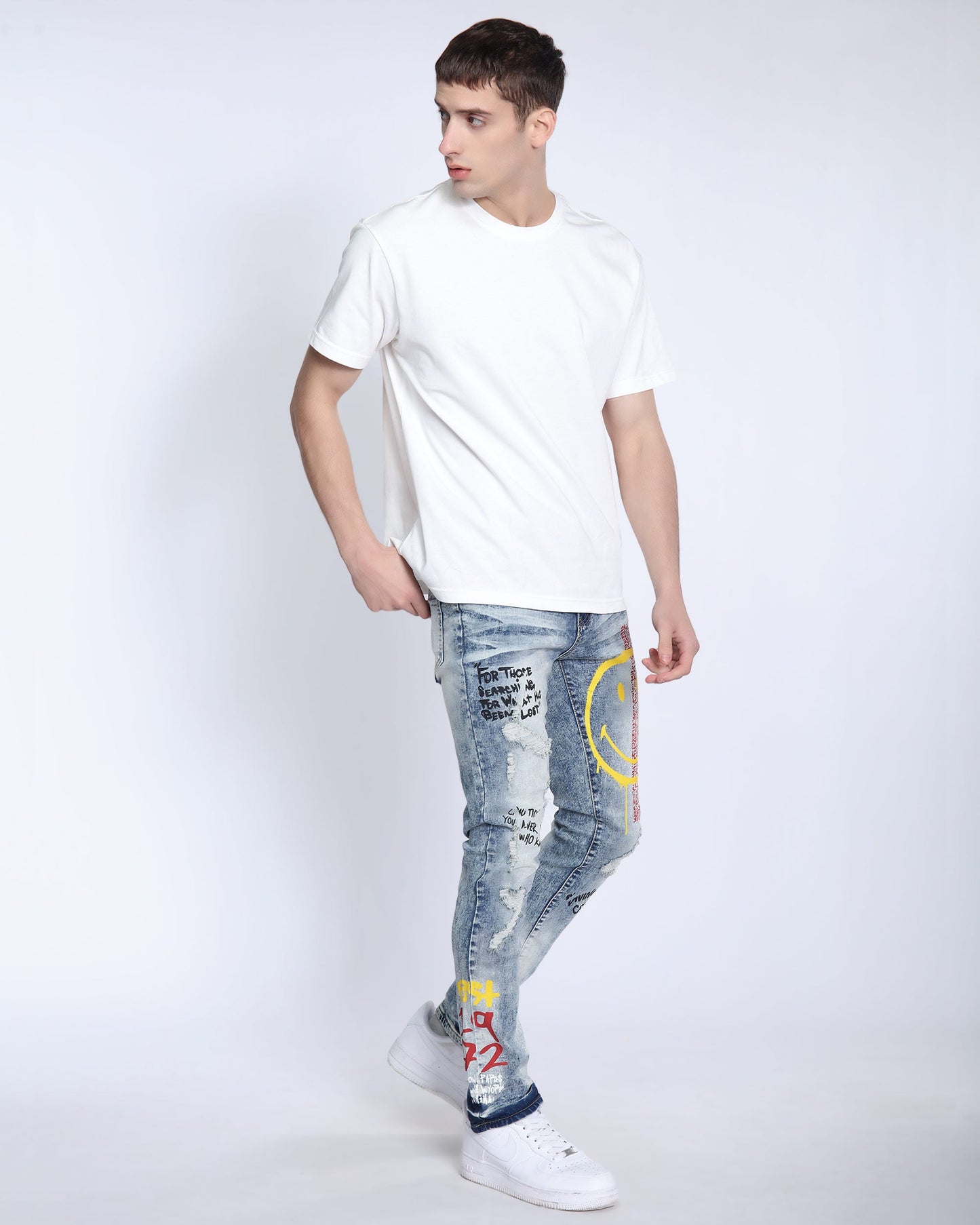 Logeqi light wash ripped jeans featuring graffiti designs and a slim fit for trendy casual wear