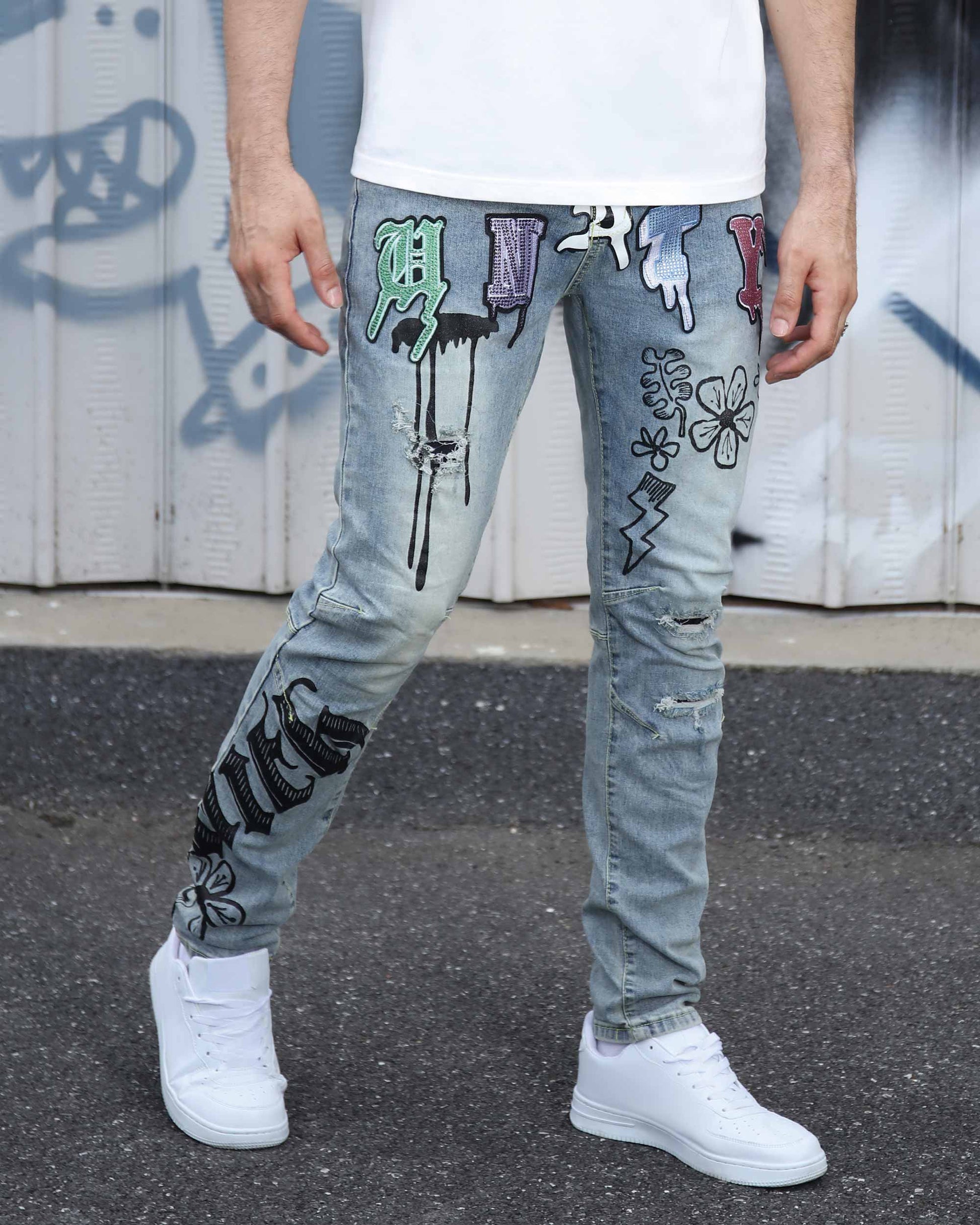 Logeqi light wash street art jeans with colorful graffiti designs and distressed details
