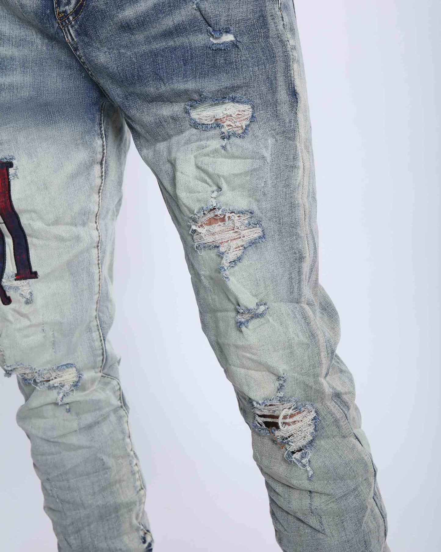Logeqi light washed ripped jeans featuring stylish distressed details for a trendy look