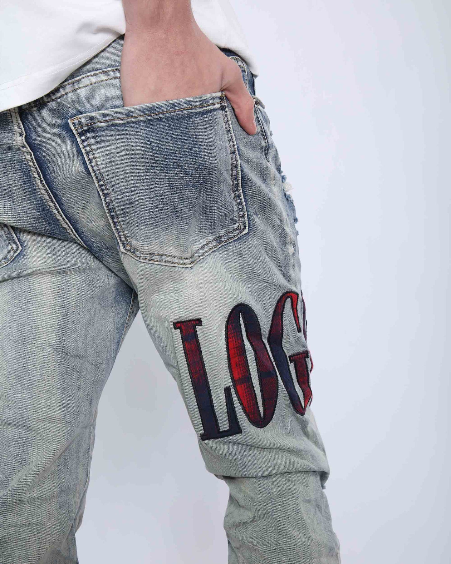 Logeqi light washed ripped jeans featuring a stylish logo on the side for a trendy look