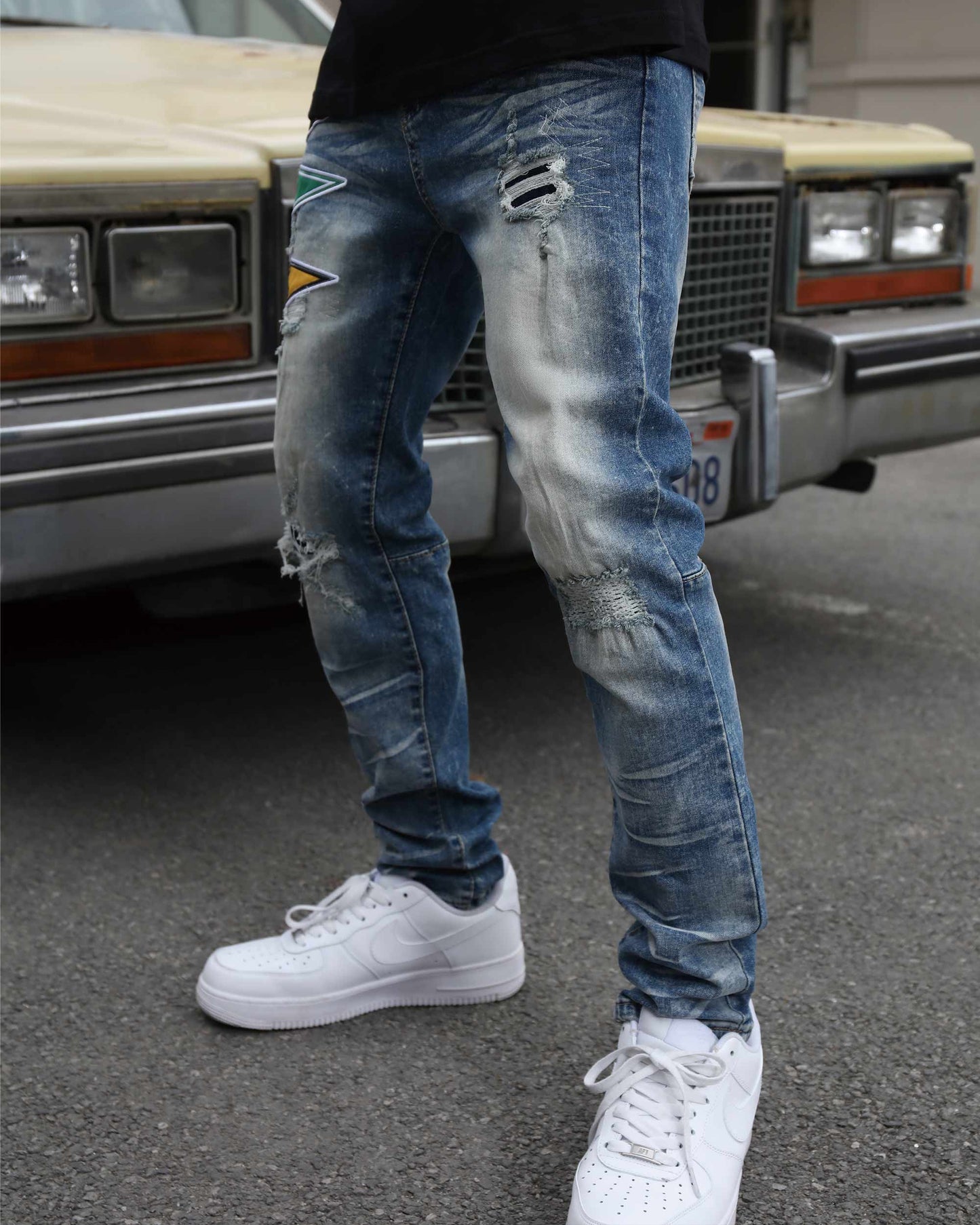 Logeqi medium wash distressed jeans with stylish rips and a slim fit design