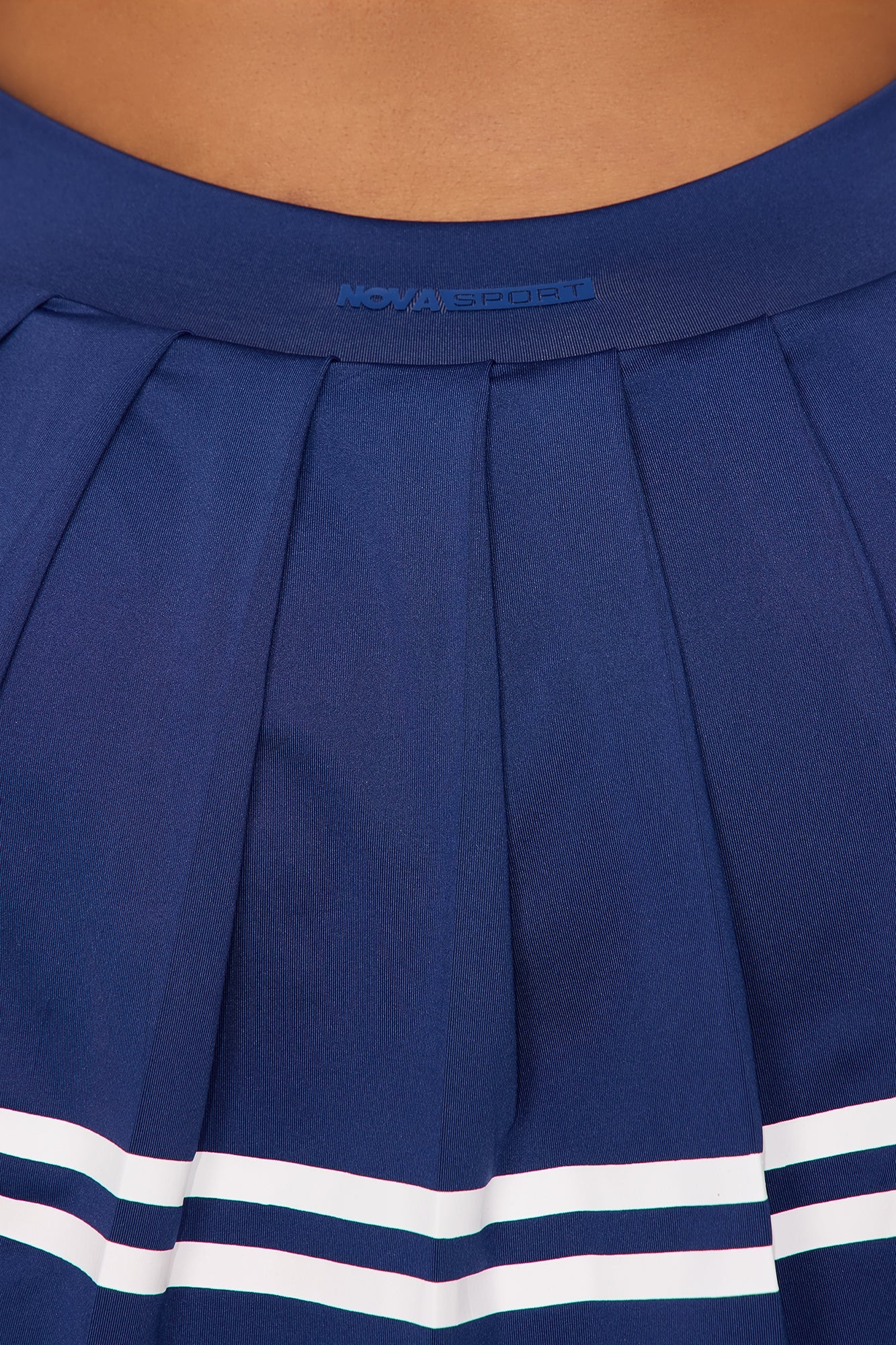 Midnight blue active skirt with pleats and white stripes by Fashion Nova for sporty looks