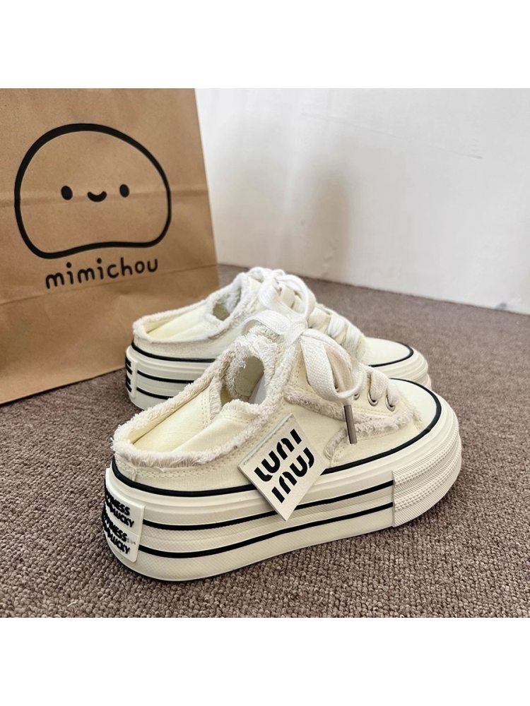 Wholesale7 lace up flat heel slippers in white with soft fabric and black striped sole