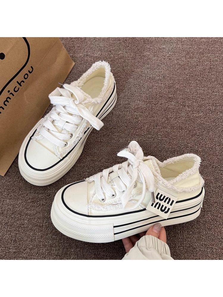 White lace up flat heel slippers with black stripes and soft textured lining from wholesale7