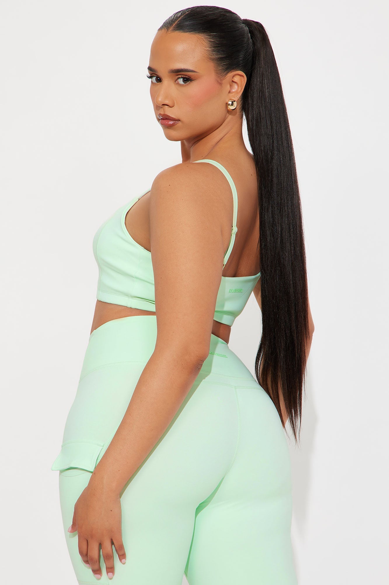 Fashion Nova mint sports bra for women with adjustable straps and a stylish back design