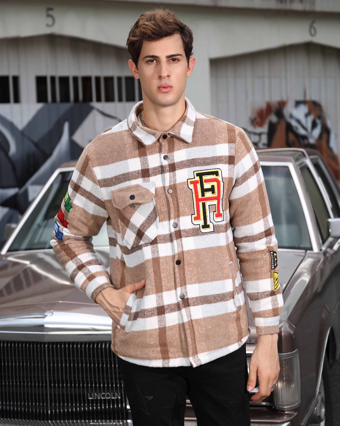 Logeqi modern plaid moto jacket in beige and white with colorful patches on a male model