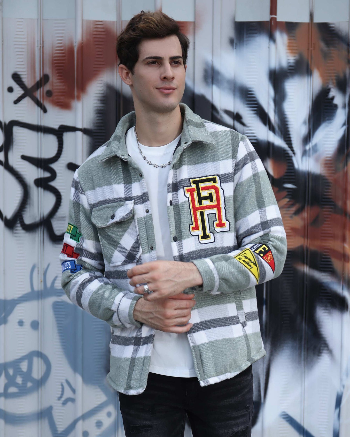 Logeqi modern plaid moto jacket in gray and white with colorful patches worn by a male model