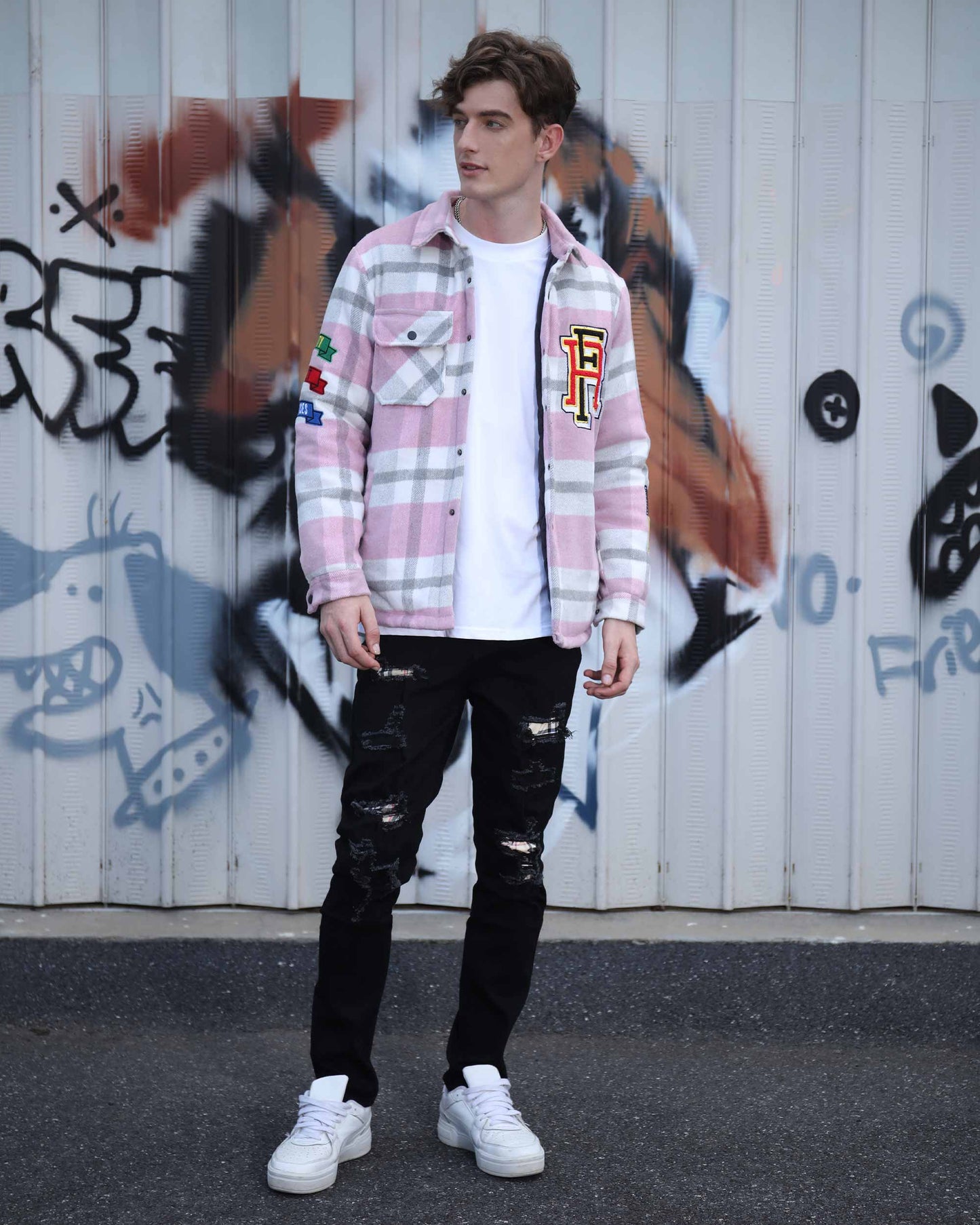 Logeqi modern plaid moto jacket in pink and white check worn with black ripped jeans and white sneakers