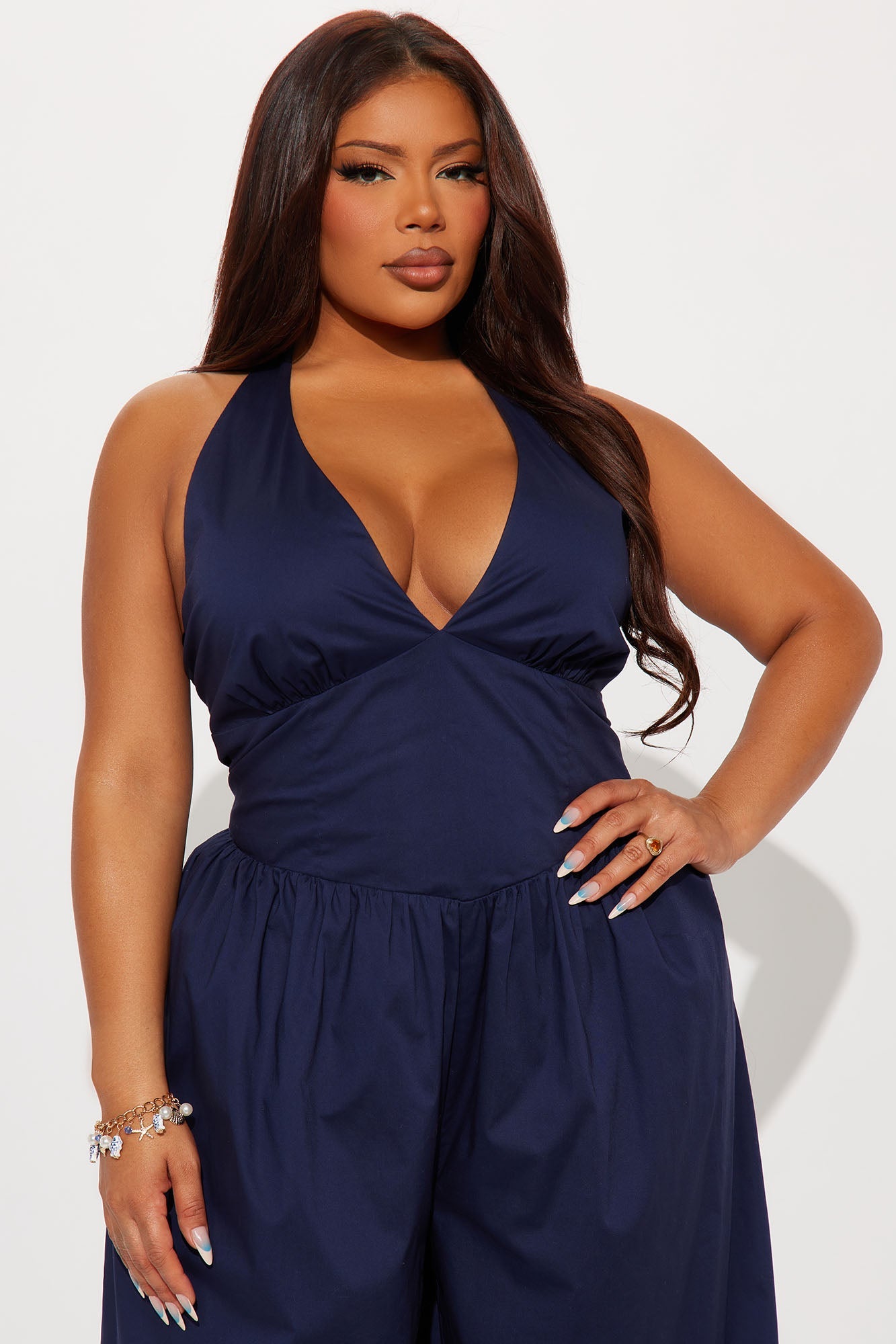 Stylish navy halter jumpsuit for women featuring a deep V-neck and comfortable fit