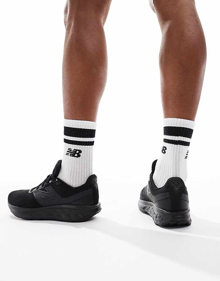 New Balance 520 running shoes in black worn with white New Balance socks for men