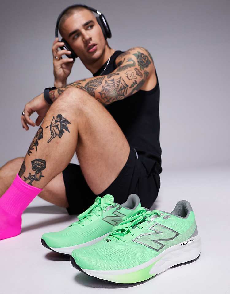 Modan Online New Balance 520 running shoes in green with gray accents displayed next to a tattooed man wearing black activewear