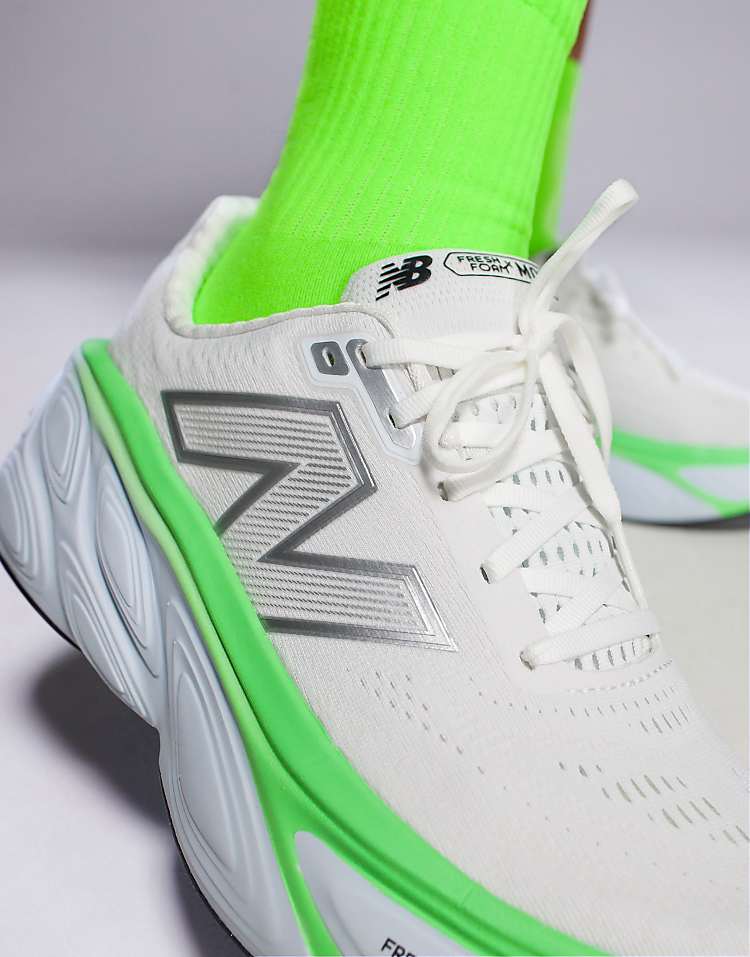 Modan Online men's New Balance running shoes black with white and green accents and bright green socks