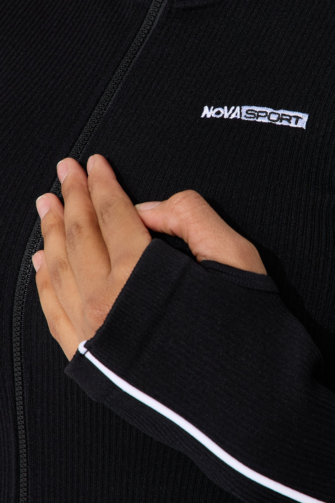 Seamless black active jacket for women by Nova Sport with zip closure and stylish cuffs
