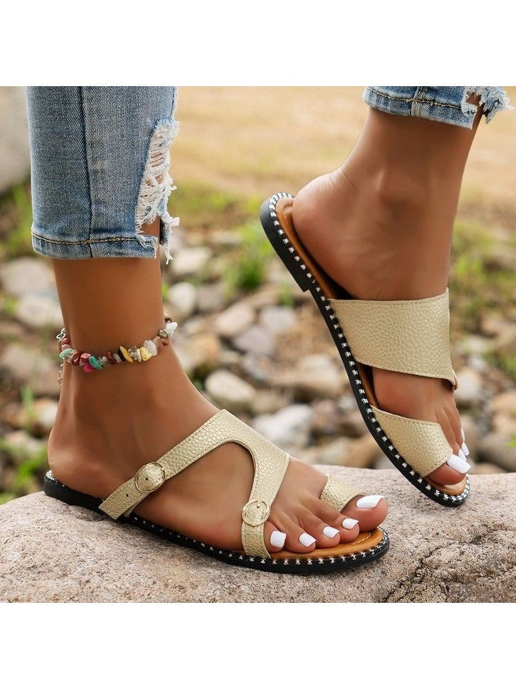 Wholesale7 beige open toe flat sandals for teens with buckle straps and black studded soles
