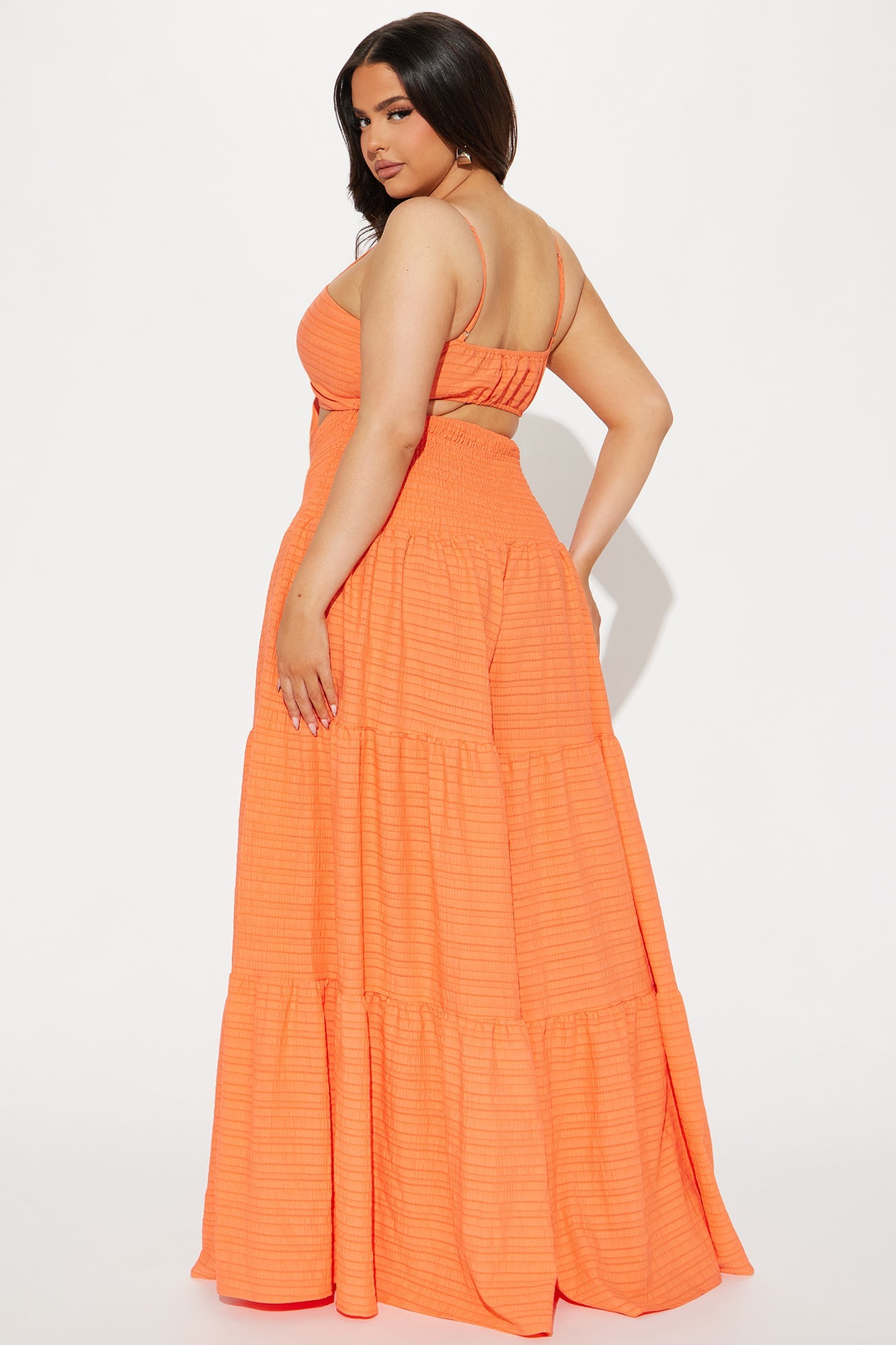 Fashion Nova orange jumpsuit for women with a flowy, tiered design and adjustable straps.