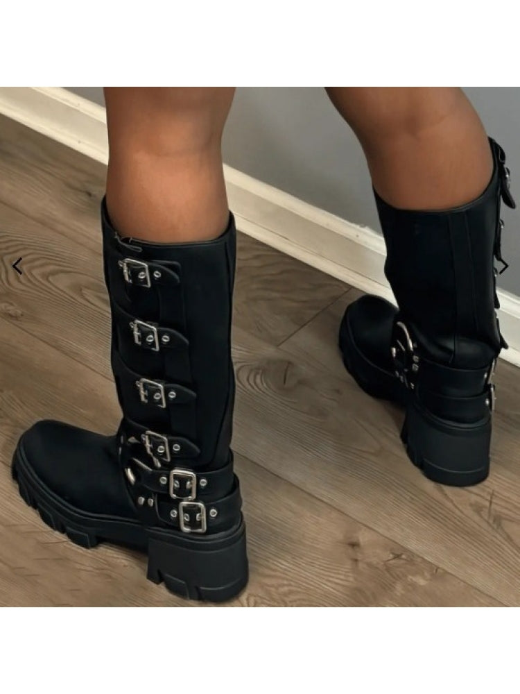Wholesale7 black patchwork chunky boots with multiple buckle straps and thick soles on model