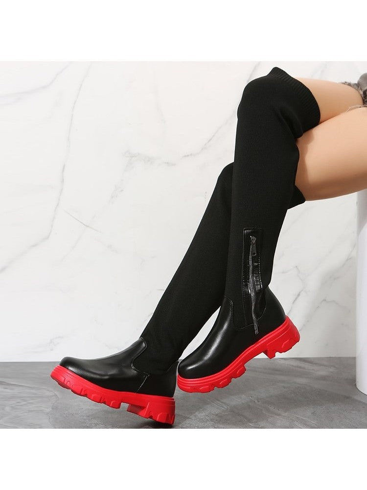 Wholesale7 patchwork over the knee boots in black with red chunky soles and side zipper detail