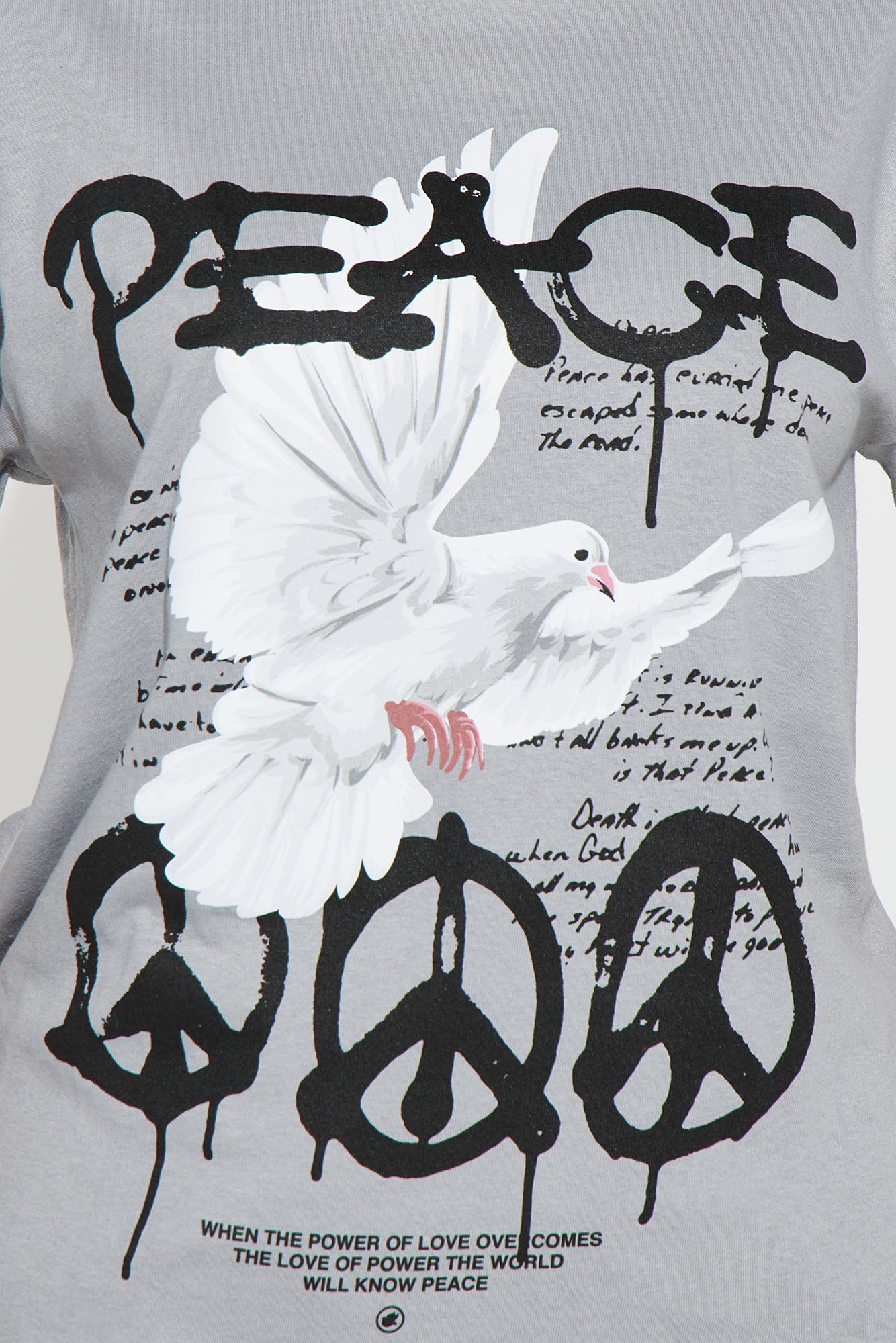 Peace graphic t-shirt for women featuring a dove and peace symbols on a grey background