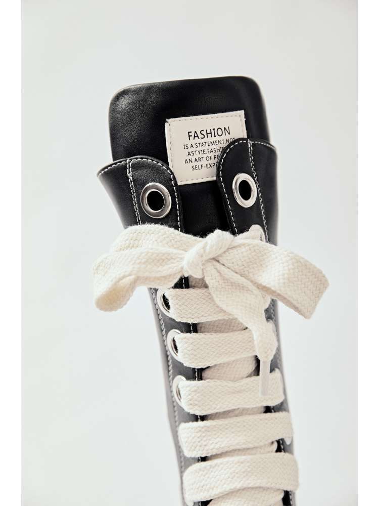 Black platform high top boots with white thick laces and fashion label on tongue