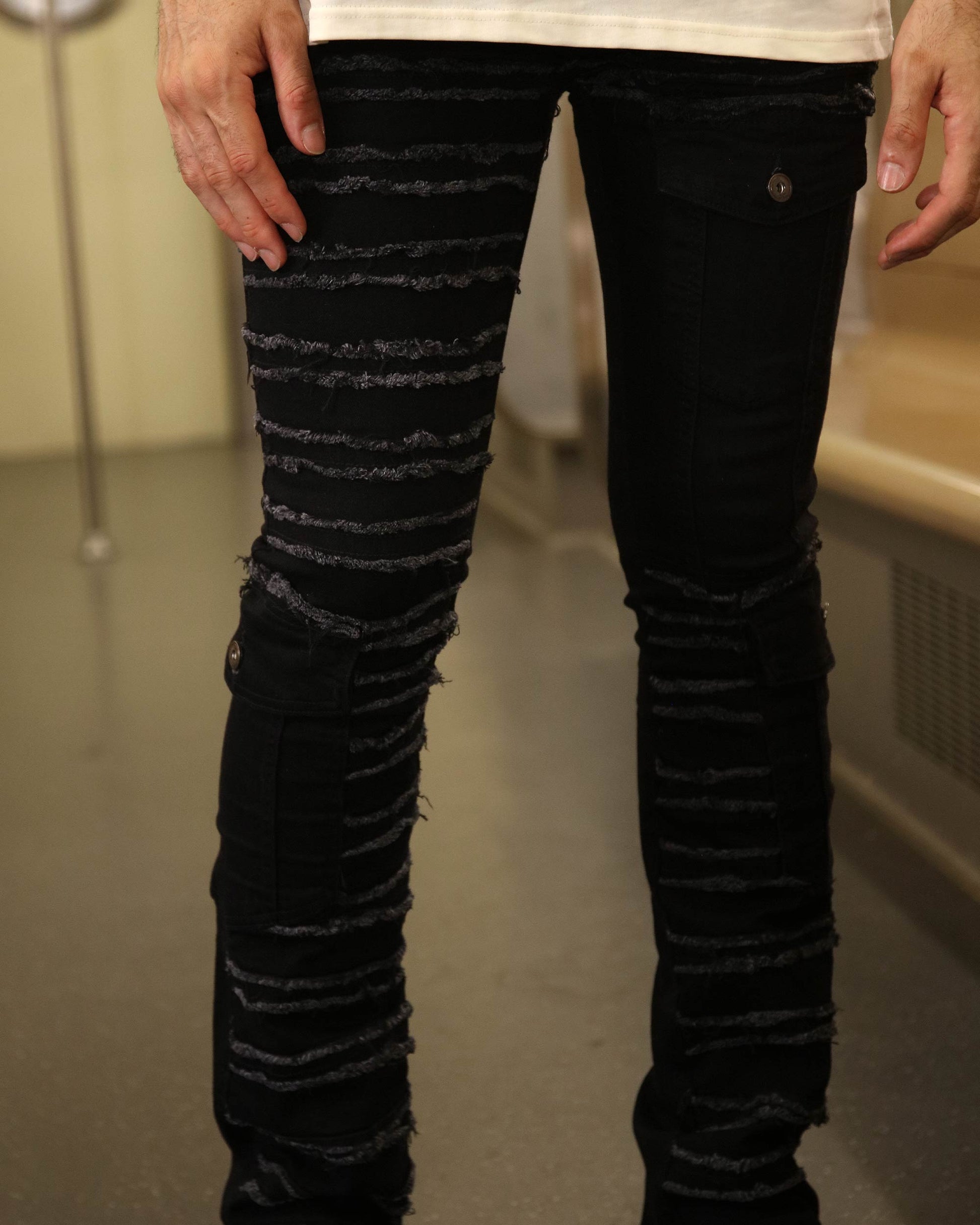 Logeqi raw edge black jeans with distressed horizontal frayed stripes and slim fit design