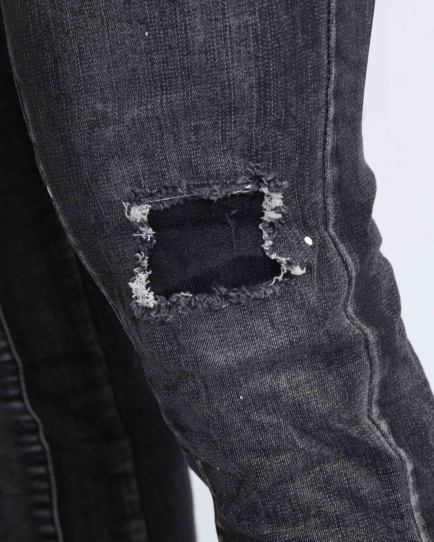 Logeqi ripped black jeans for men featuring distressed knee detailing for a stylish look