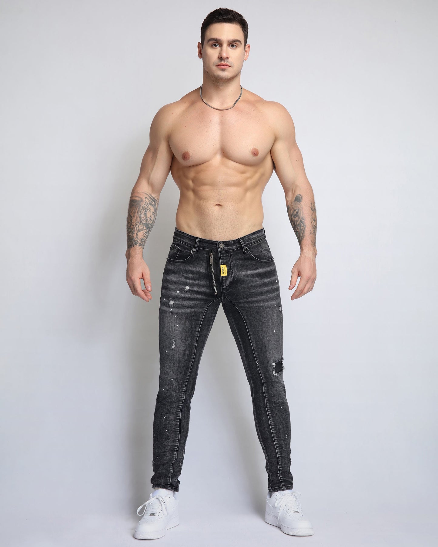 Stylish ripped black jeans for men, featuring a slim fit and distressed details for a trendy look