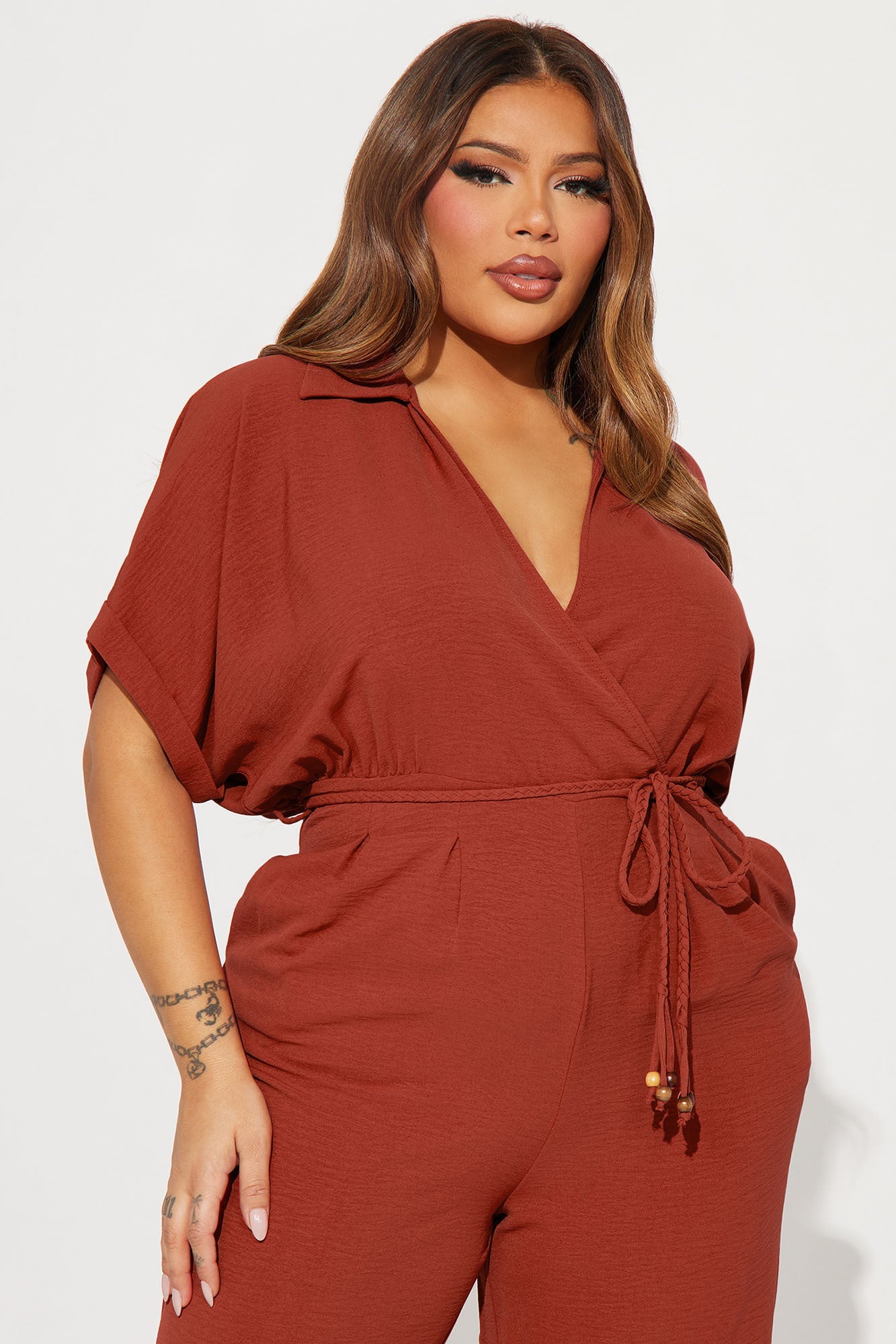 Fashion Nova rust jumpsuit for women with a stylish collar and tie waist detail