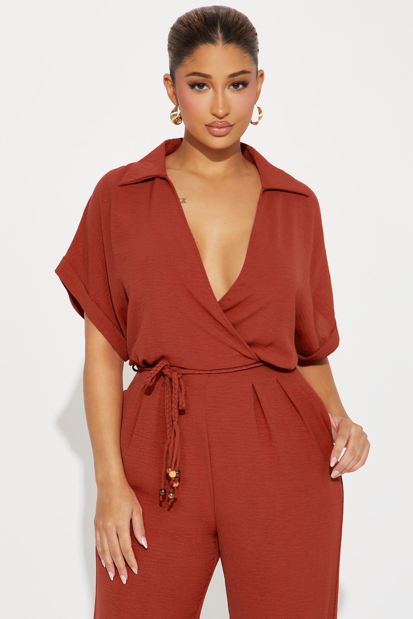 Fashion Nova rust jumpsuit for women with short sleeves and a wrap style for a stylish look