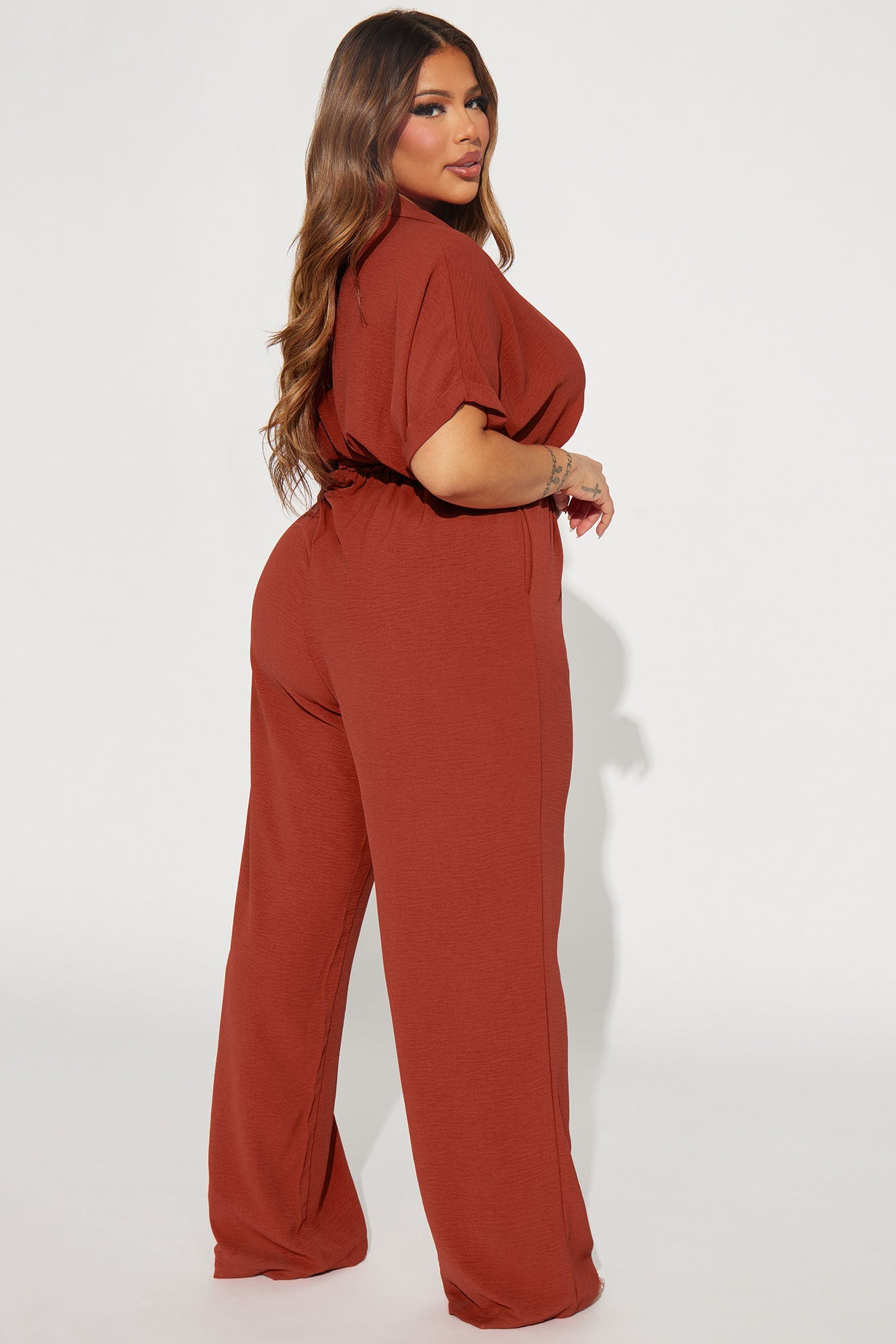 Elegant rust jumpsuit for women with a relaxed fit and stylish silhouette from Fashion Nova