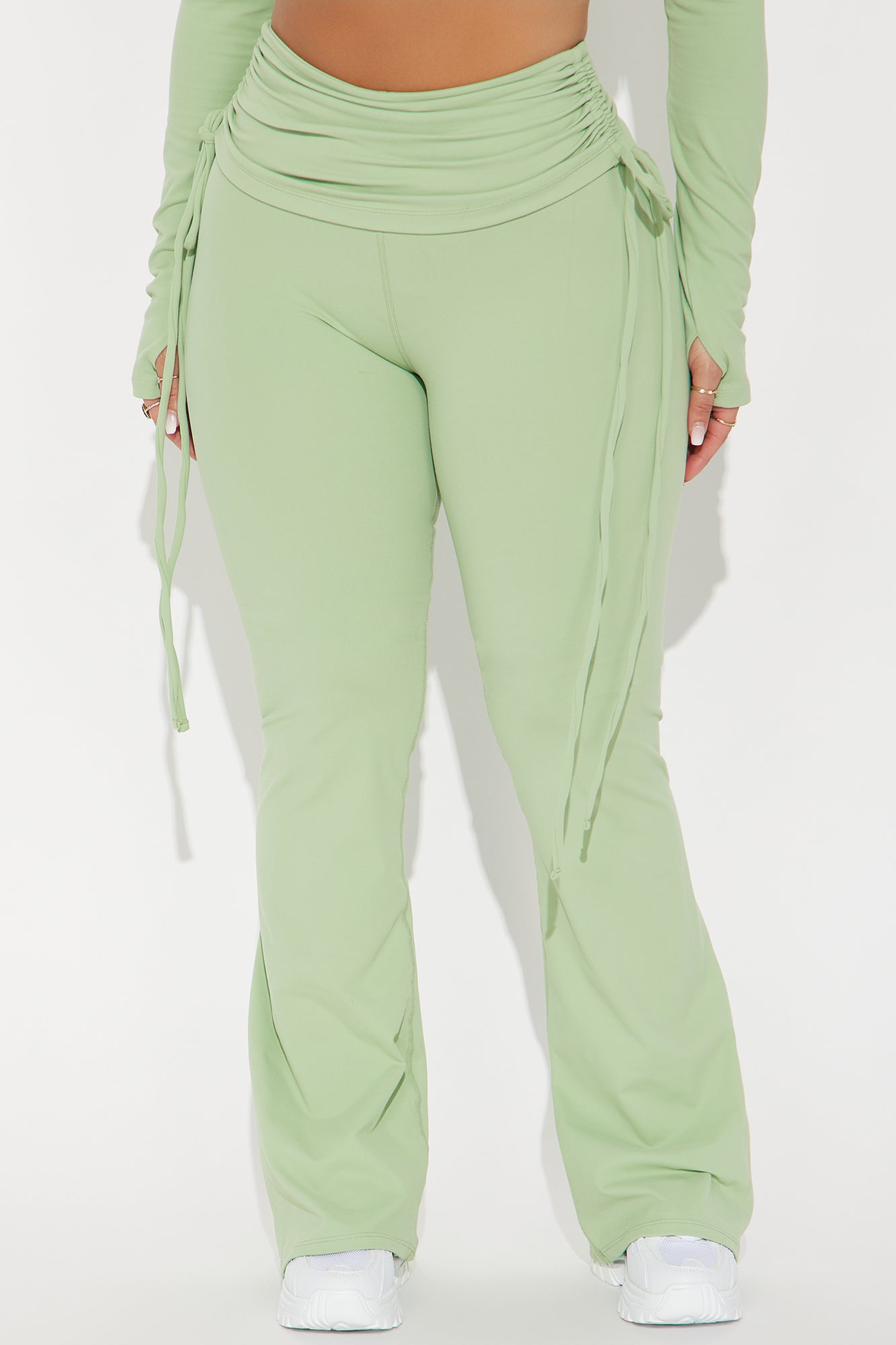 Sage green active pants for women with adjustable ties and flared legs for a stylish look
