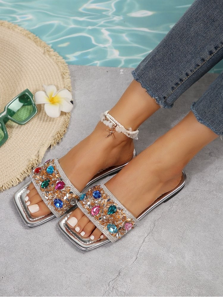 Wholesale7 rhinestone flat heel slippers with colorful gems and silver base worn with casual jeans