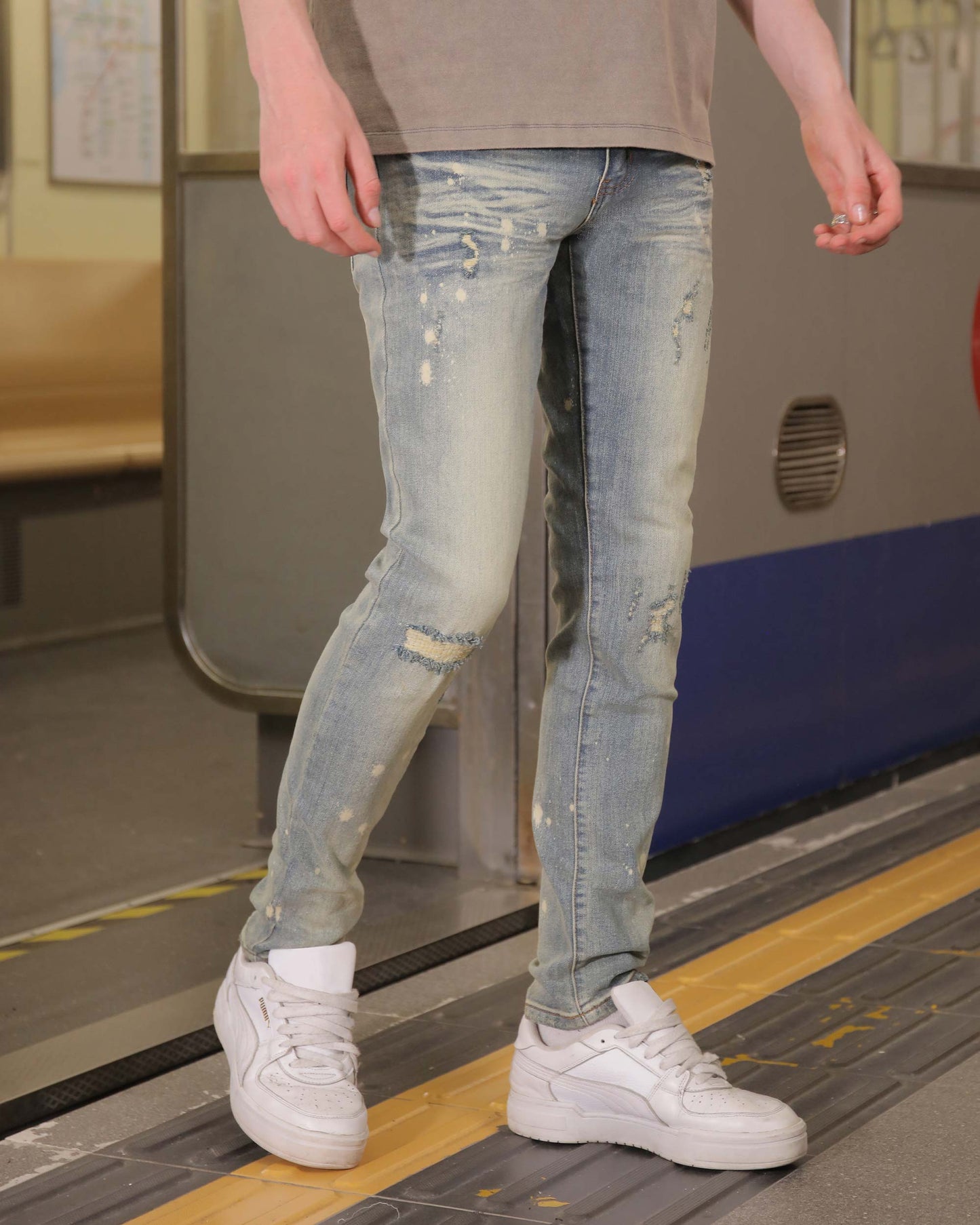Logeqi slim fit distressed jeans in light blue with trendy ripped detailing for a casual look