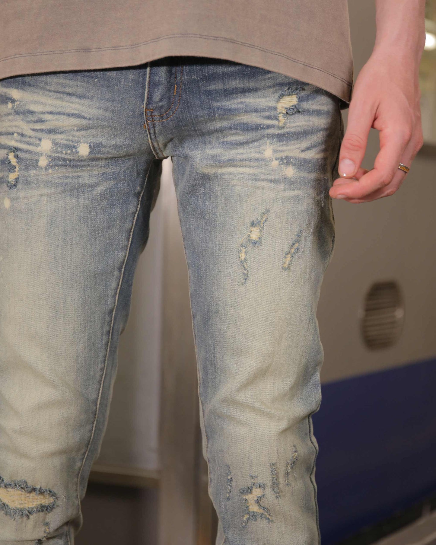 Logeqi slim fit distressed jeans with a light blue wash and trendy ripped detailing