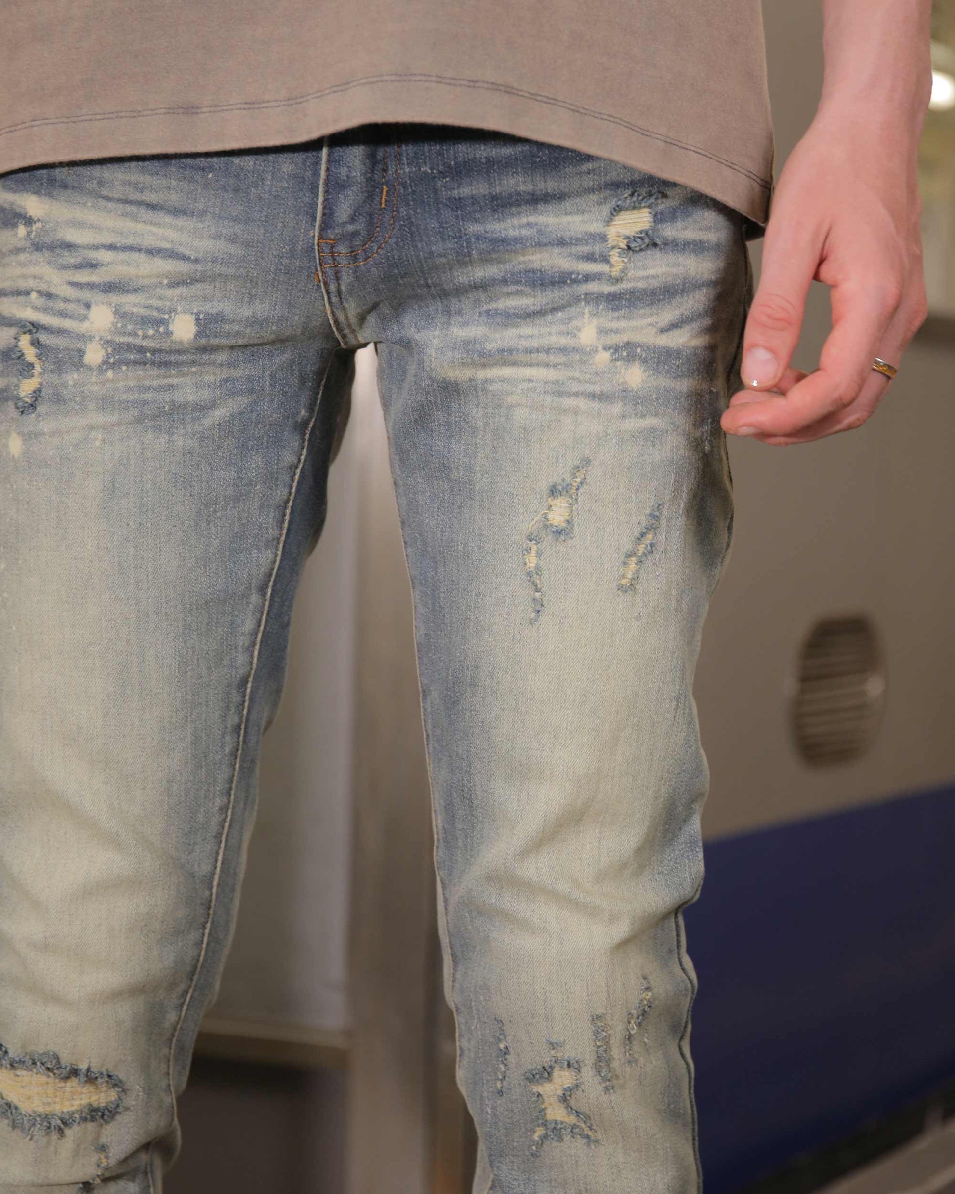 Logeqi slim fit distressed jeans with a light blue wash and trendy ripped detailing