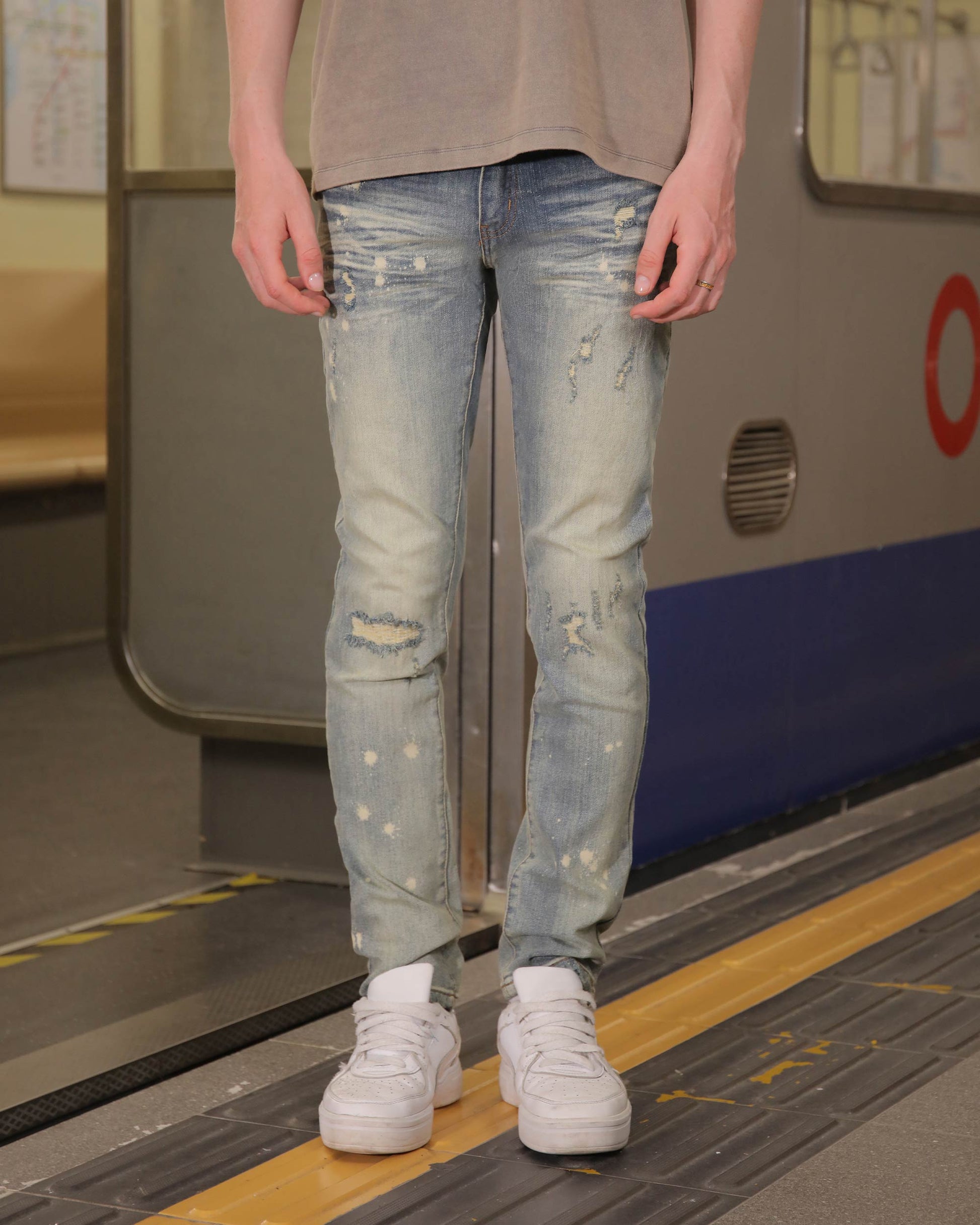 Logeqi slim fit distressed jeans in light blue with stylish rips and a modern look