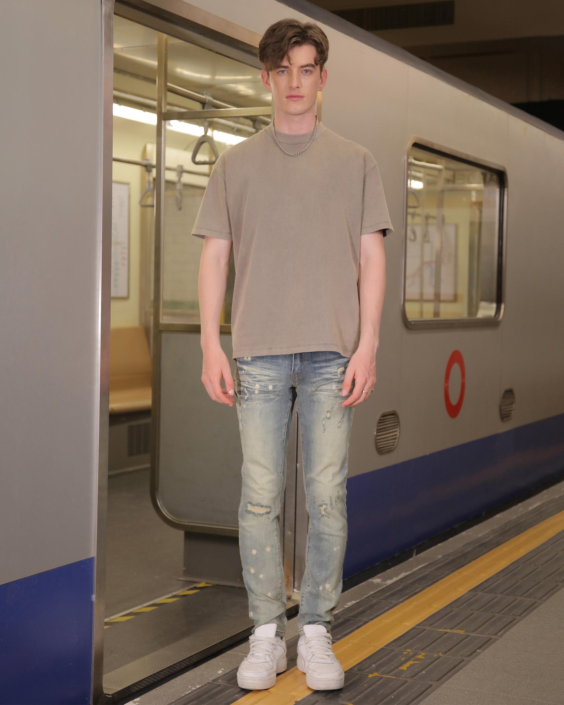 Logeqi slim fit distressed jeans featuring a trendy light wash and stylish ripped details