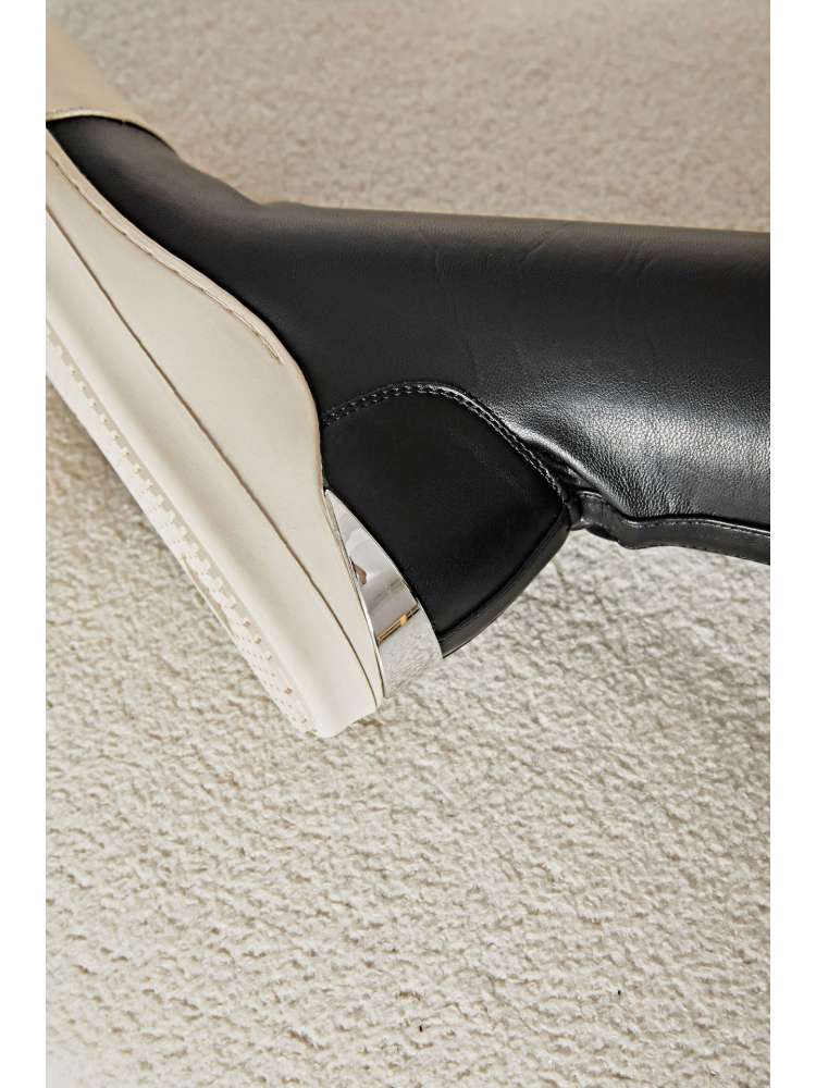 Wholesale7 solid PU patchwork boots in black and white with a silver accent heel detail