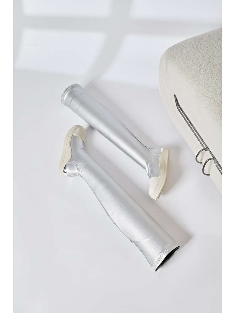 Silver solid PU patchwork boots with off-white soles from wholesale7 laid flat on white surface