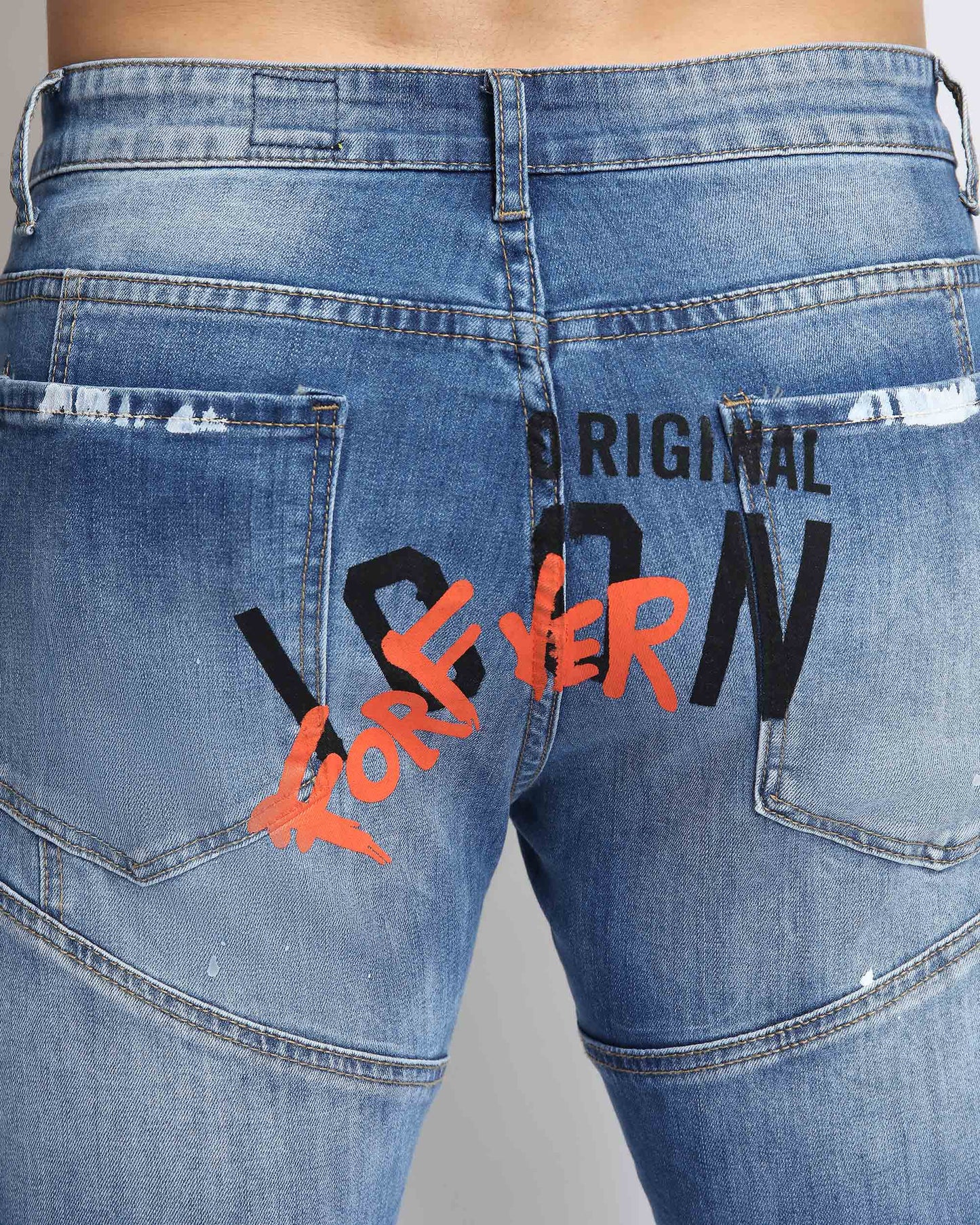 Logeqi spray paint ripped jeans with distressed detailing and bold graphic designs on the back
