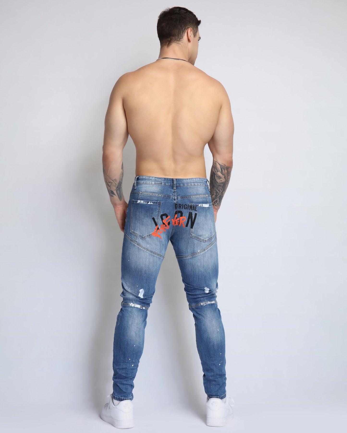Logeqi spray paint ripped jeans in blue with distressed details and a slim fit design