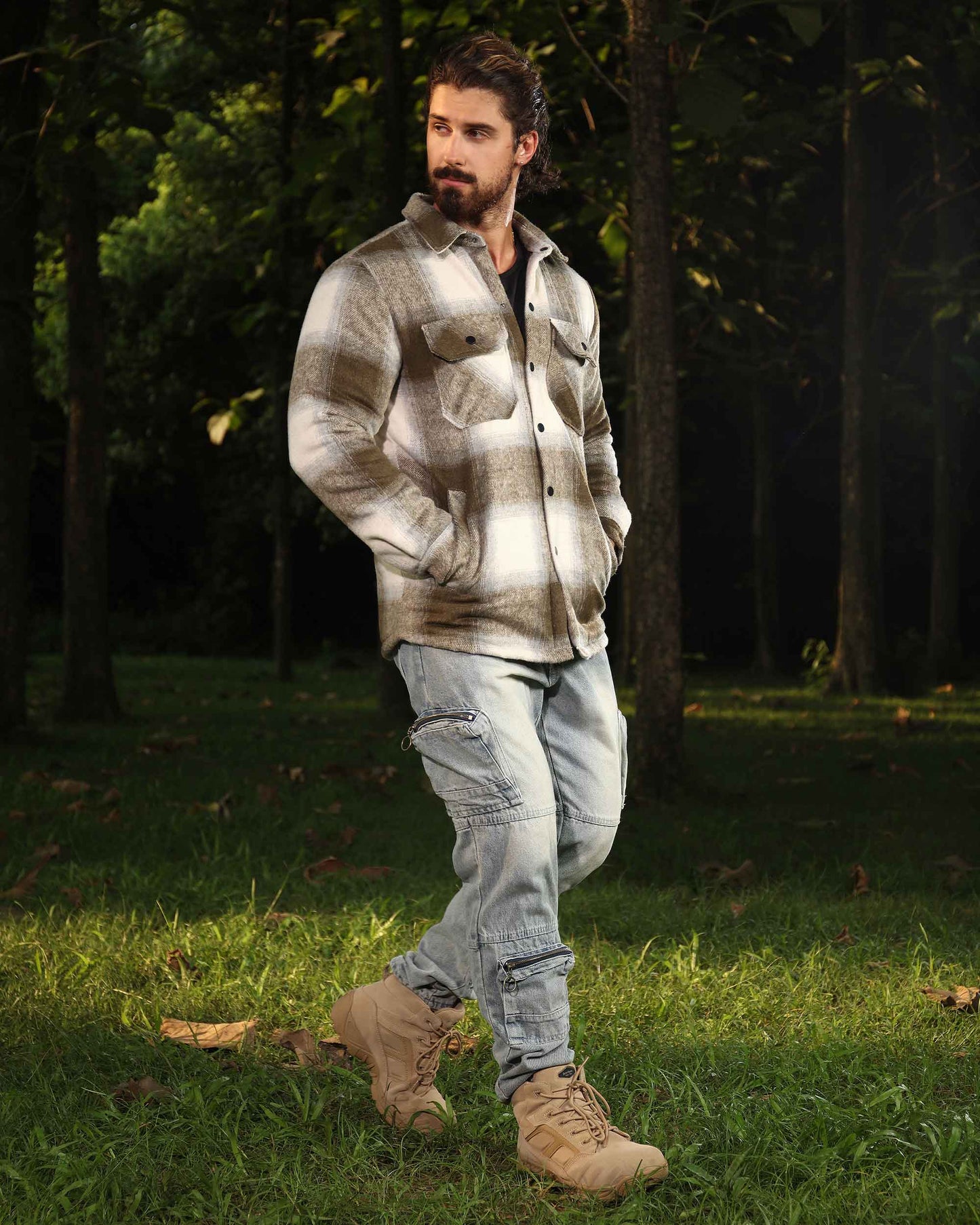 Man wearing Logeqi spring plaid jacket in beige tones paired with light cargo pants and boots outdoors