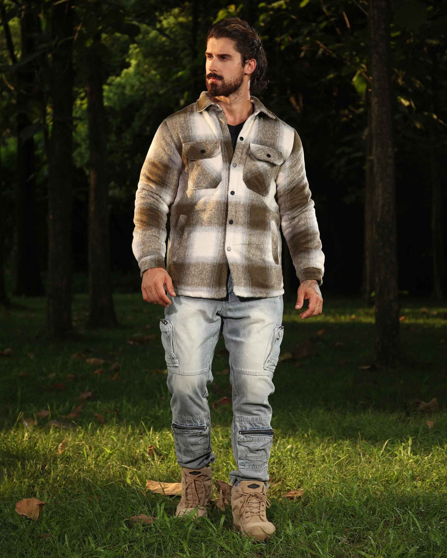 Man wearing Logeqi spring plaid jacket in neutral tones with light cargo pants outdoors