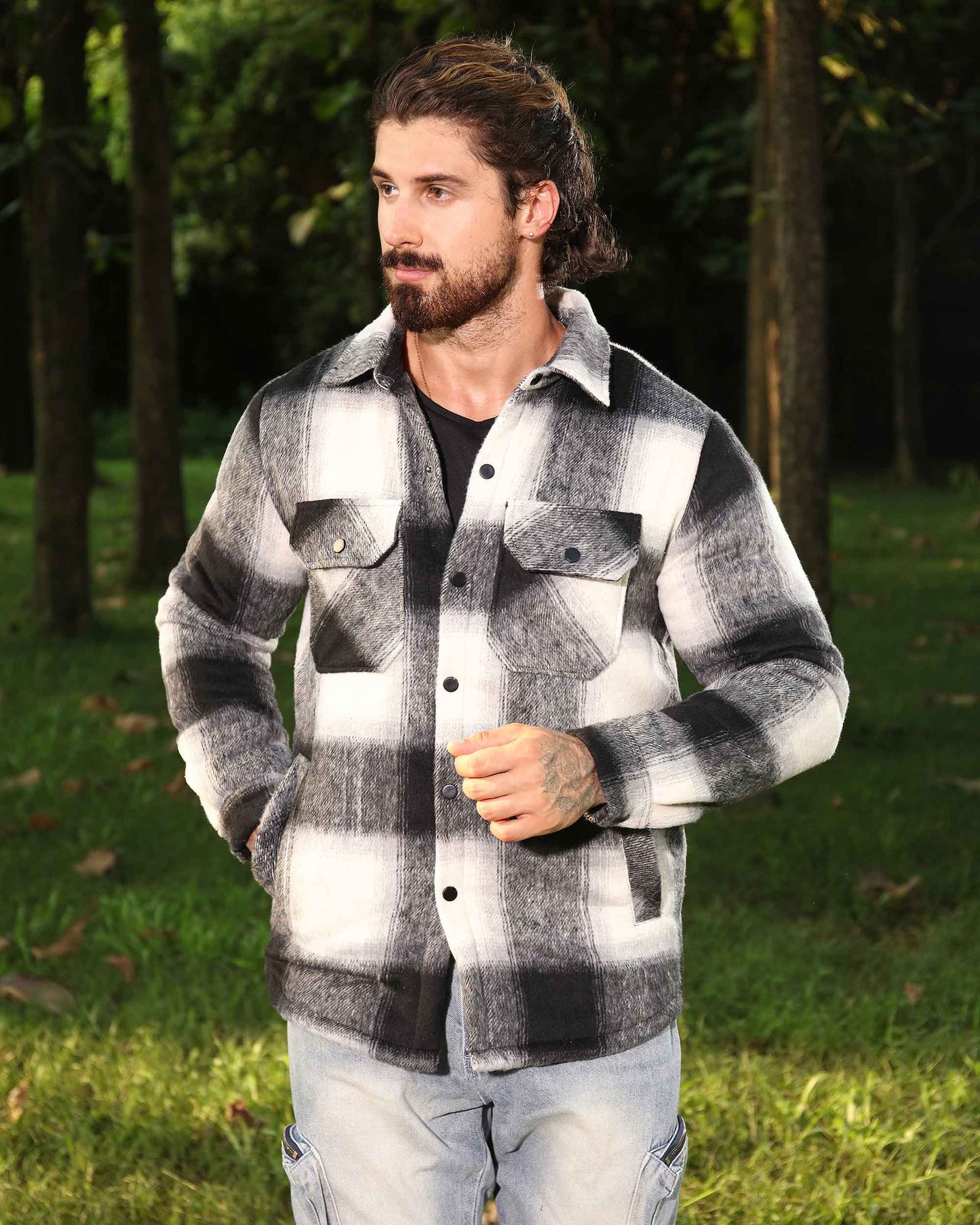 Logeqi black and white spring plaid jacket worn by man outdoors in forest setting